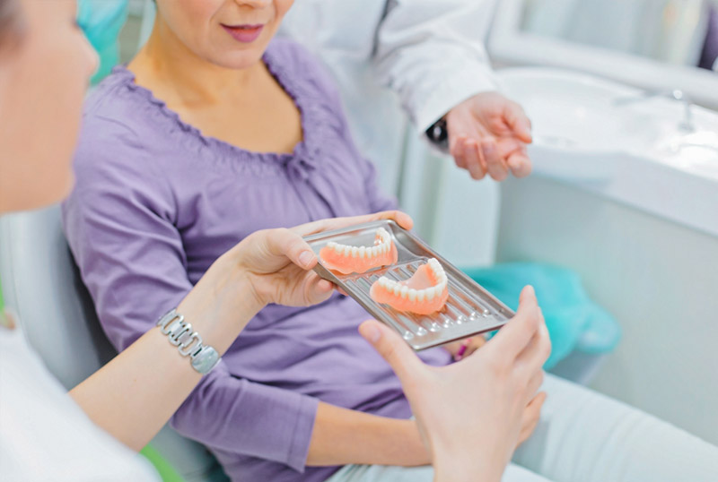 Woman getting dentures in Richmond Hill