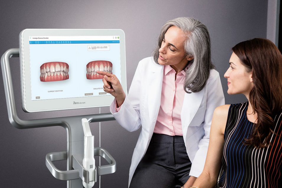 Dentist explaining the dental issue to patient using dental technology in Richmond Hill