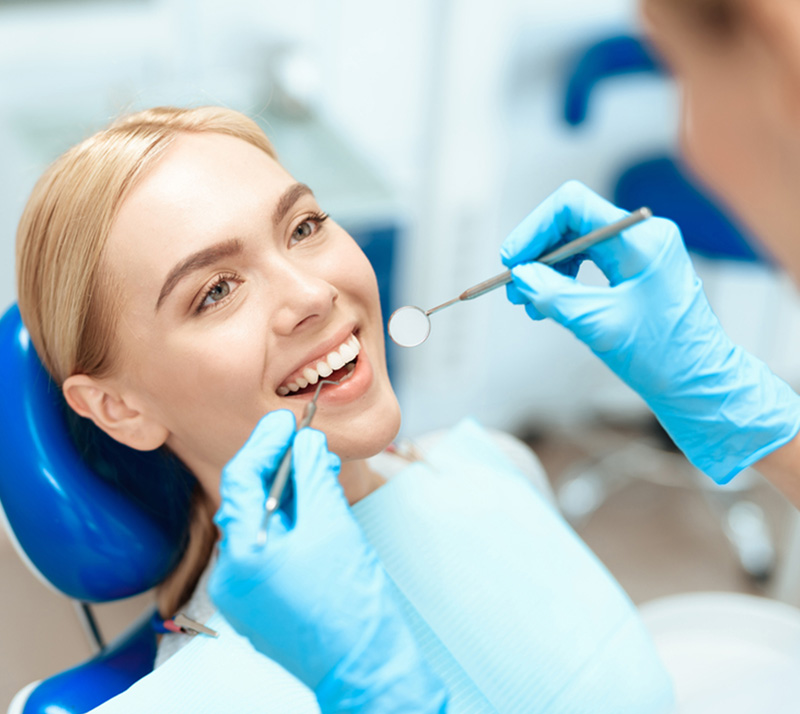 patient getting comprehensive oral exam at nearest dental clinic