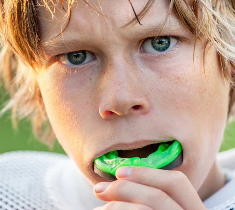 Boy wearing sports guard before game, get your dental appliance near you at Carrville Family Dentistry