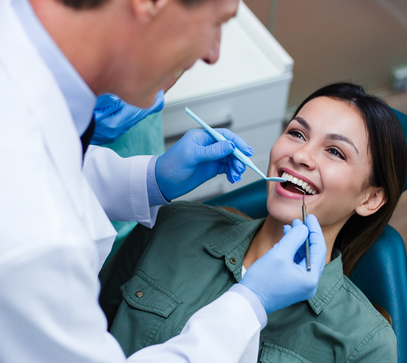 Woman getting treatment of dental bridges in Richmond Hill