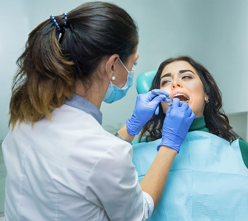 Dentist treating patient in your nearest general dentistry